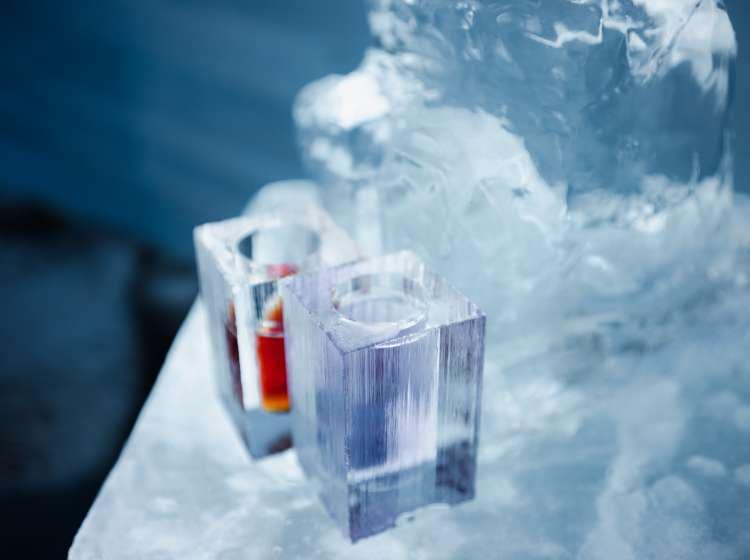 Ice glasses and drinks on an ice table near Kiruna, Swedish Lapland, Sweden