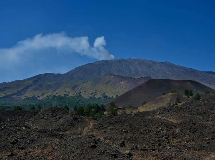 North side of Mt. Etna  with  Mt. Sartorius seen from road  and quot Mareneve and quot. Smoke coming out from crater &quot Bocca Nuova and quot.