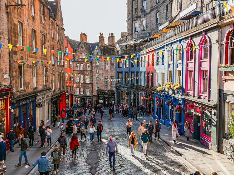 Aerial view of the famous colorful Victoria Street in the Old Town of Edinburgh, Scotland, England, Victoria Street in the United Kingdom, Victoria Street in the old town in Edinburgh Scotland England Crowds of tourists on the Royal Mile,harry potter city
Victoria Street, a picturesque and winding cobblestone lane, is one of Edinburghâs most iconic thoroughfares. Prior to its construction, access from the Grassmarket to the Lawnmarket was via the West Bow, a very steeply sloped and narrow lane. The new street was planned to demolish much of the old West Bow, and provide a broad sweeping link to the newly built George IV Bridge.