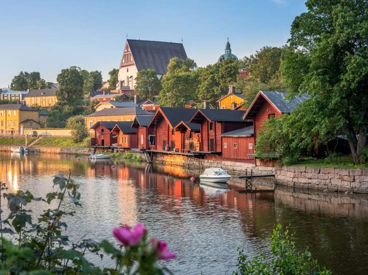 Beautiful city landscape with idyllic river and old buildings at summer evening in Porvoo, Finland