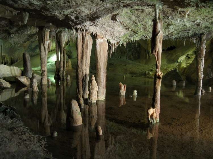 Stalactites, stalagmites and transparent underground lake in Can Mark Cave, Port de Sant Miguel, Ibiza, Spain; Shutterstock ID 557035048; Invoice Number: -