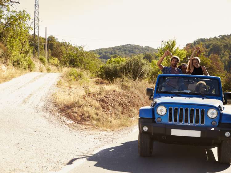 Friends in an open car, passengers standing in the back; Shutterstock ID 507414514; Invoice Number: -