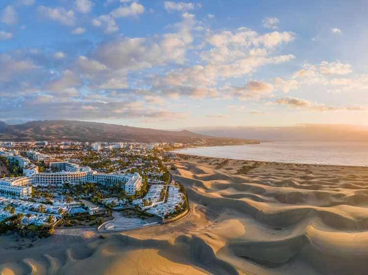 Landscape with Maspalomas town and golden sand dunes at sunrise, Gran Canaria, Canary Islands, Spain