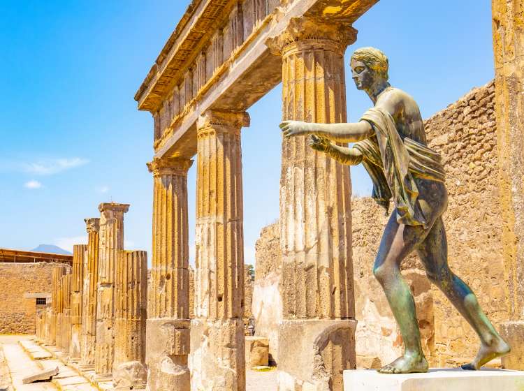 Ancient Pompeii city skyline and bronze Apollo statue, Italy travel photo