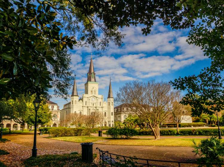 A shot of Andrew Jackson on his horse raring up in Jackson Square in New Orleans with St. Louis Cathedral in the background.