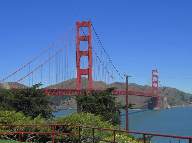 Golden gate bridge vivid day landscape, in clear blue sky with green grass as foreground. San Francisco, USA.; Shutterstock ID 566707153; Invoice Number: -