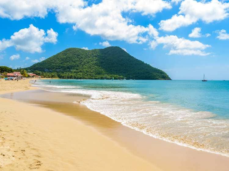 Reduit Beach - Tropical coast on the Caribbean island of St. Lucia. It is a paradise destination with a white sand beach and turquoiuse sea.