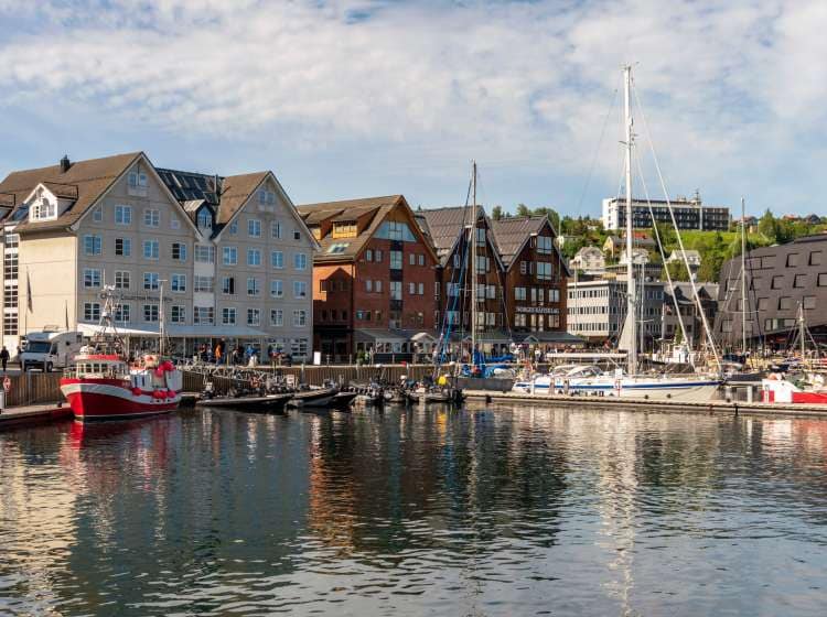 The city of TromsÃ¸ Norway, a city in northern Norway, on  1 July 2018. Tromso is a major cultural center located above the Arctic Circle. The city is a good base for viewing the colorful Northern Lights.