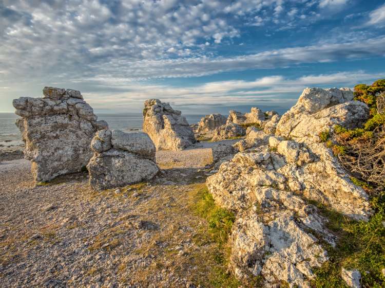 Nordic light at Langhammars on Faro island in Sweden.Faro island in the Baltic sea is famous for its unique limestone sea stacks.; Shutterstock ID 208477564; Invoice Number: -