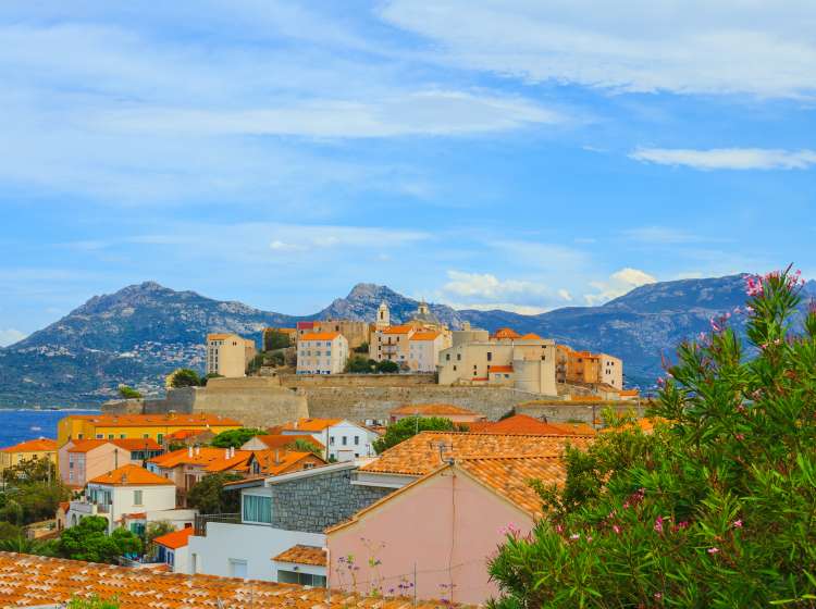 Rustic buildings in front of view of mountains