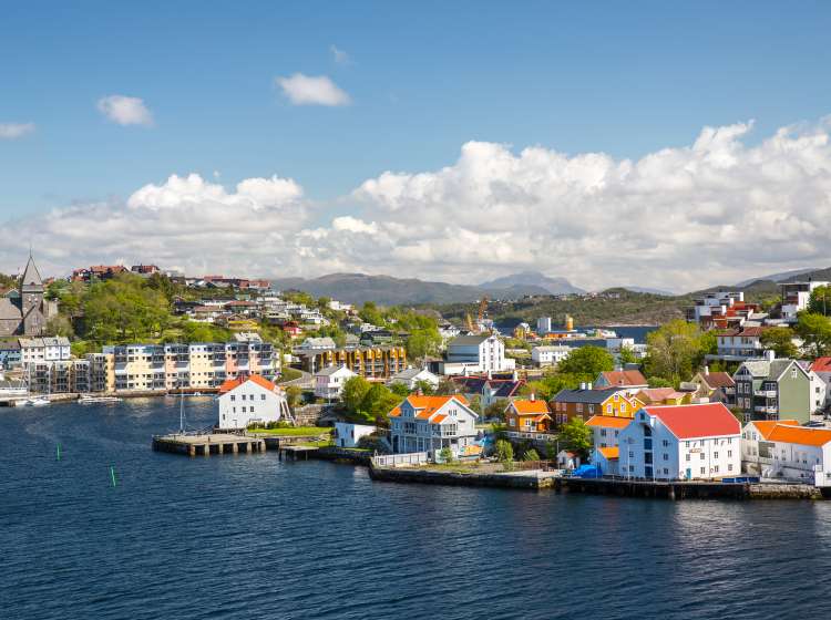  A sky view of buildings and houses behind water