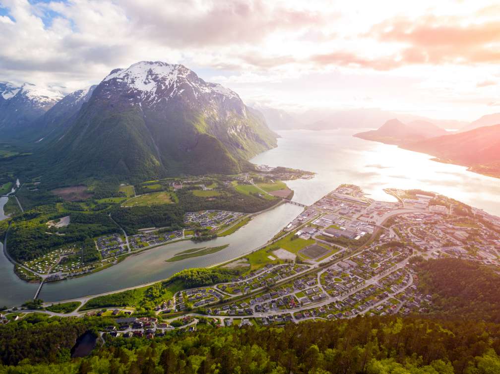 A sky view of mountains and houses