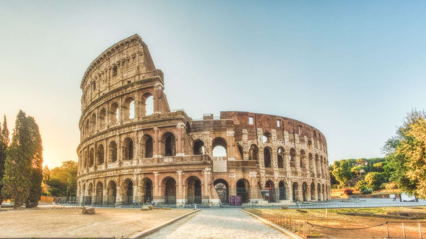 The Colosseum in Rome, Italy, during sunrise in July.