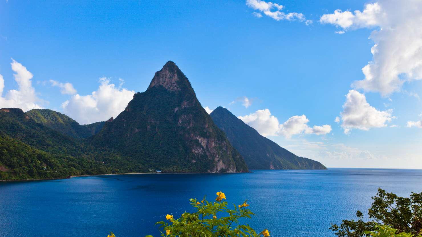 The Pitons are undoubtedly the best known natural landmark of Saint Lucia. These two twin volcanic plugs, the Gros Piton and Petit Piton, 770 and 743 meters high, respectively, are included in UNESCO World Heritage Site since 2004. They are just south of the town of Soufriere. Canon EOS 5D Mark II