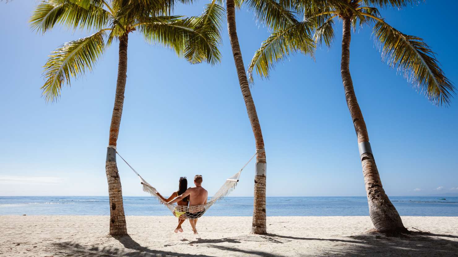 Tourist couple on the beach, Panglao, Bohol, Philippines