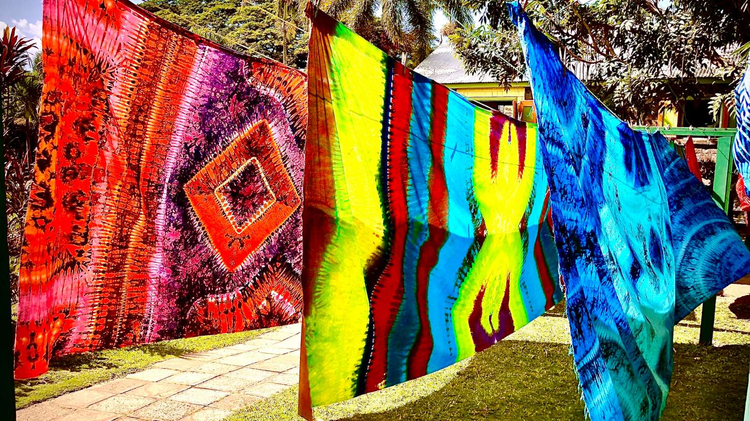 Colorful Caribbean batik patterened scarves drying in the wind