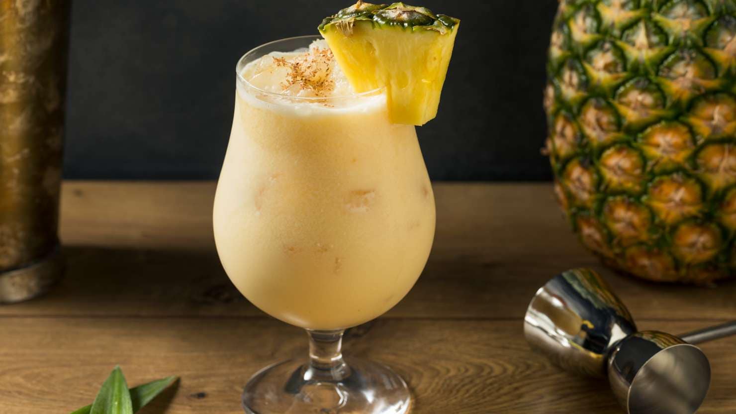 Boozy PIneapple Painkiller Cocktail with Coconut Cream and Nutmeg