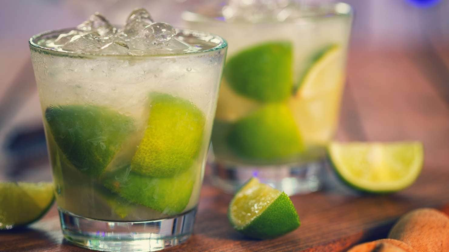 Sweet and refreshing Caipirinha national cocktail from Brazil made with lime,ice, sugar, and a sugarcane liquor