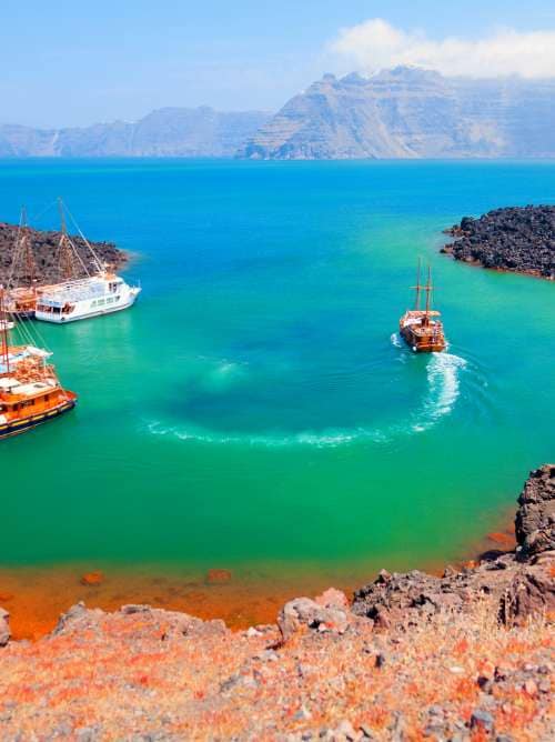 There are volcano cruises and short trips from Fira with a boat and a lot of tourists visit the volcanic landscape; Shutterstock ID 262527038; project: Marketing; job: Content Marketing; client: PO Cruises; other: 