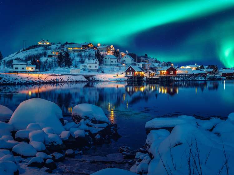 Scenic photo of winter fishing village with northern lights. stunning natural background. Picturesque Scenery of Reinefjord one most popular place of Lofoten islands. Norway. ideal resting place.; Shutterstock ID 1901492866; project: olly; job: ; client: pocruises; other: 