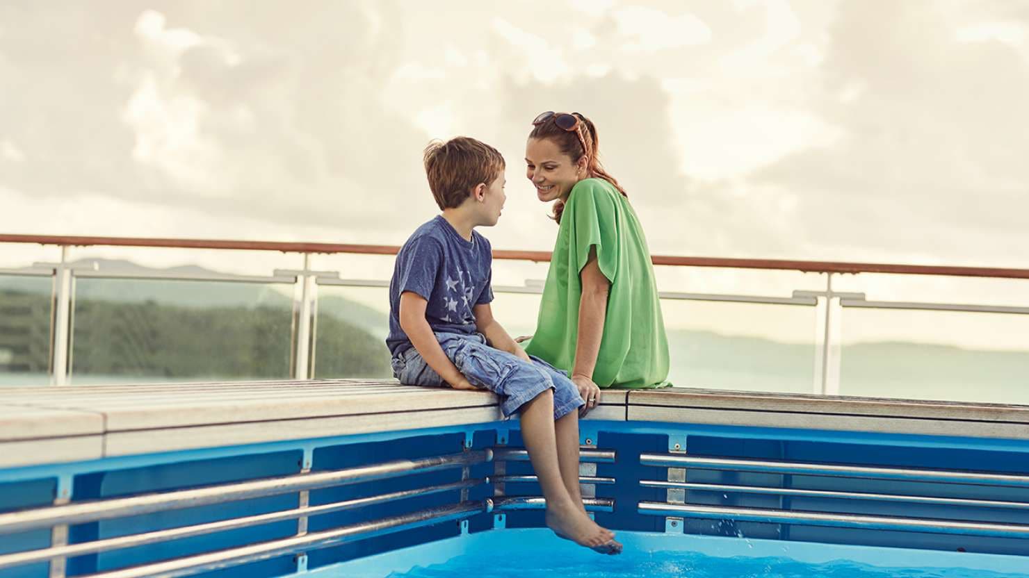 Woman and boy by the pool on-board