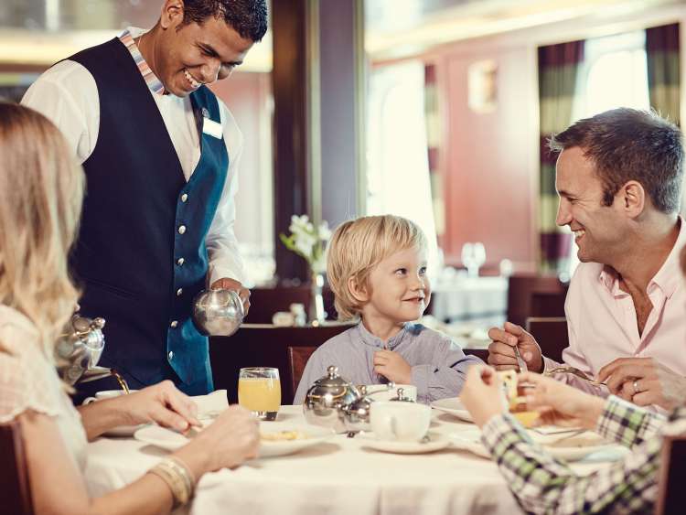 Family getting served in restaurant