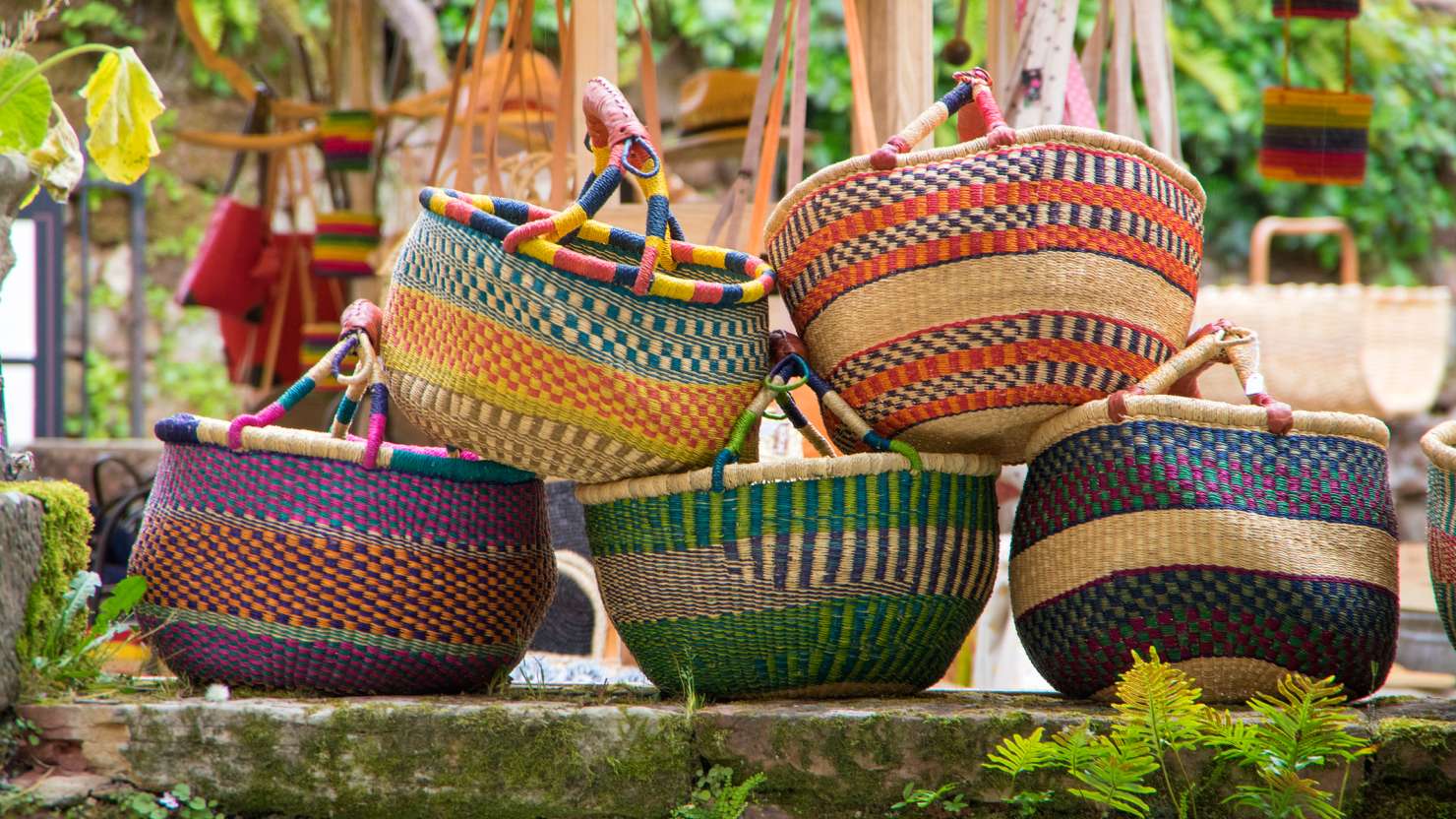 Colored wicker baskets in a market in France.