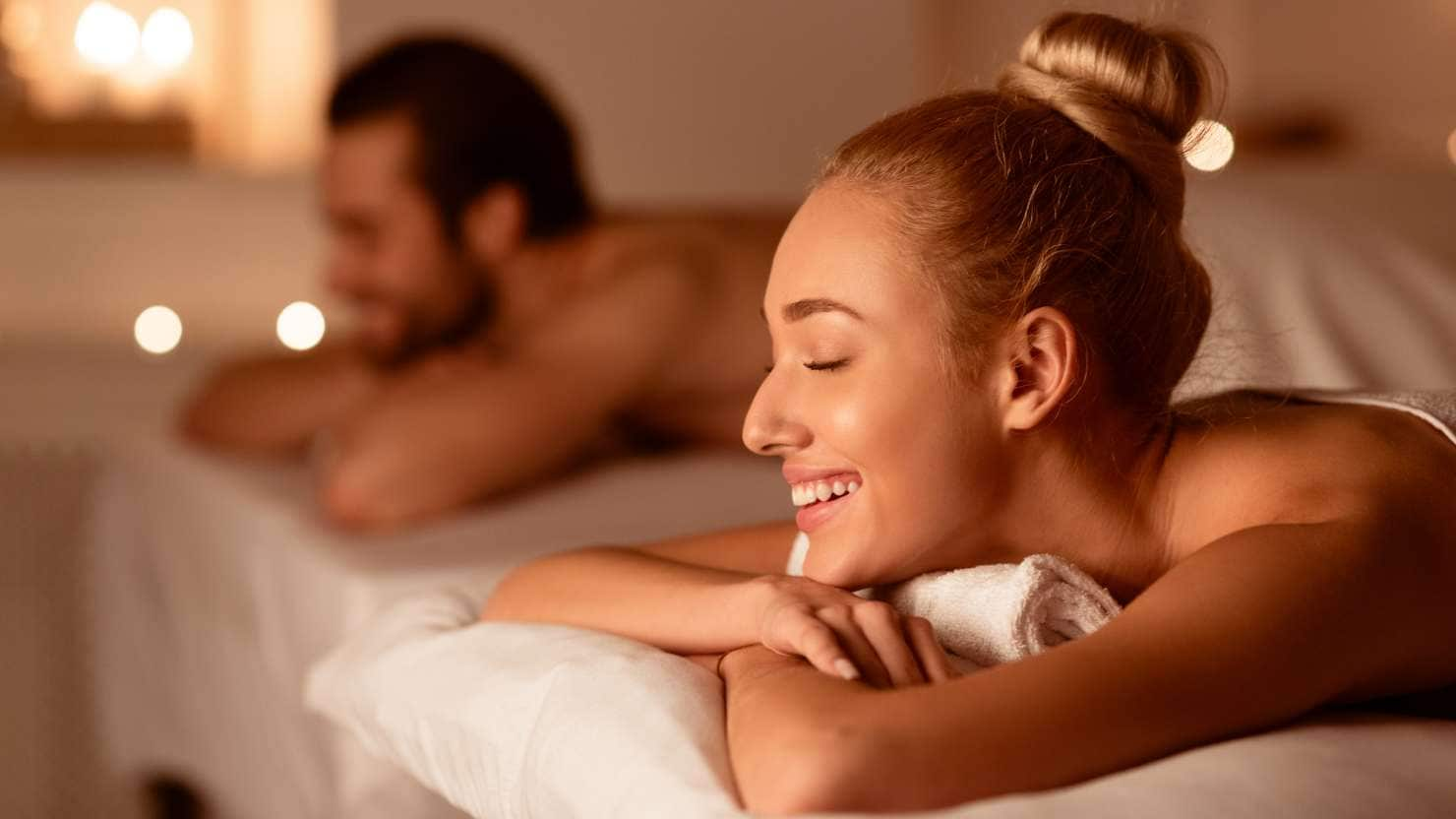 Spouses Receiving Relaxing Beauty Treatment Enjoying Aromatherapy Or Waiting For Exotic Back Massage Lying With Eyes Closed At Luxury Spa Center. Wellness And Body Relaxation. Selective Focus