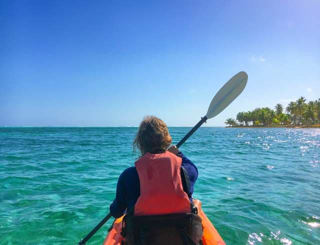 Kayaking around the north point of Half Moon Caye, Lighthouse Reef Atoll. Belize Caribbean.