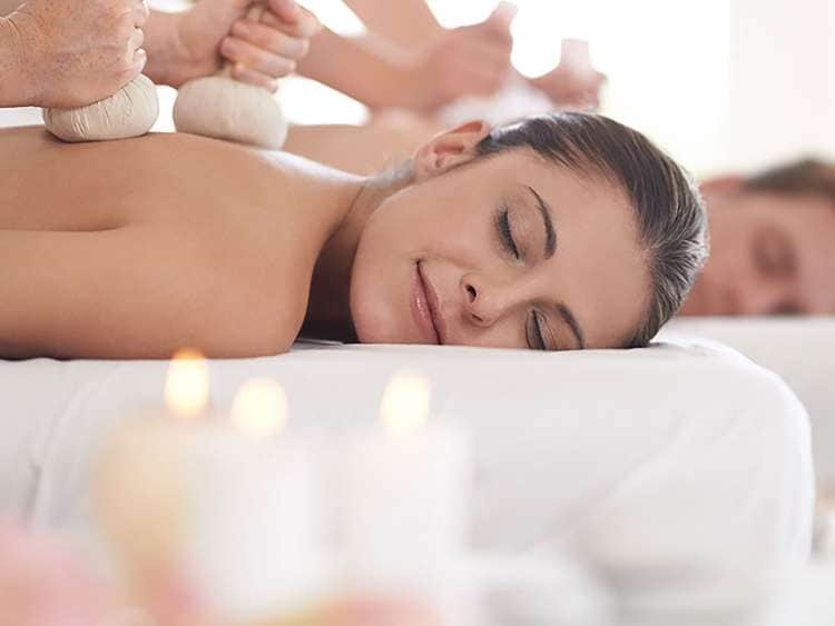 Couple having spa treatments together